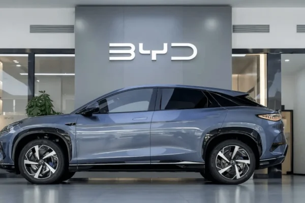 A BYD electric vehicle showroom in a Canadian urban setting, representing the Chinese automaker's entry into the Canadian market following the Carney-Xi tariff deal.