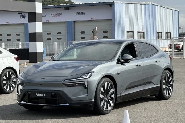 The 2026 Polestar 4 electric SUV-coupe parked in natural light showing its sloping roofline and blank rear panel where a conventional rear window would normally appear.